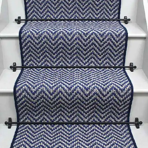 Atlantic Herringbone French Blue Stair Runner on a staircase with rods.