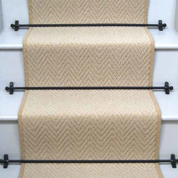 Baileys Herringbone Stair Runner on a staircase with rods.