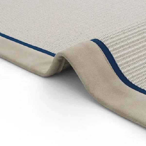 Beige woven mat with darker border and navy trim