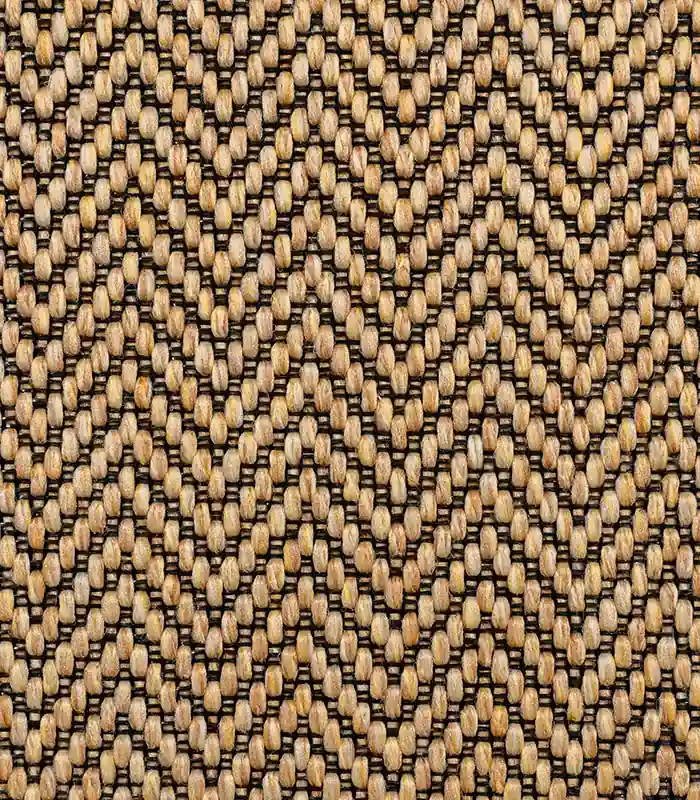 Chevron rug with light brown ovals on dark base.