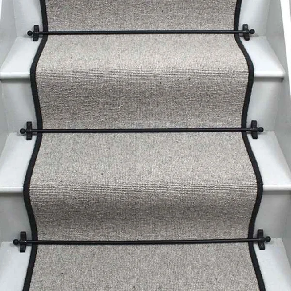 Glen Loop Wool Tungsten Stair Runner with a black binding and black stair rods. (1)
