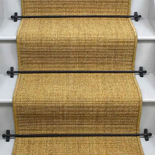 Natural mini boucle sisal stair runner with black edging and black stair rods. (1)